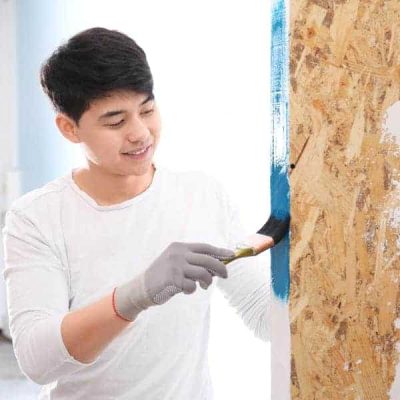 reliable man painting wall